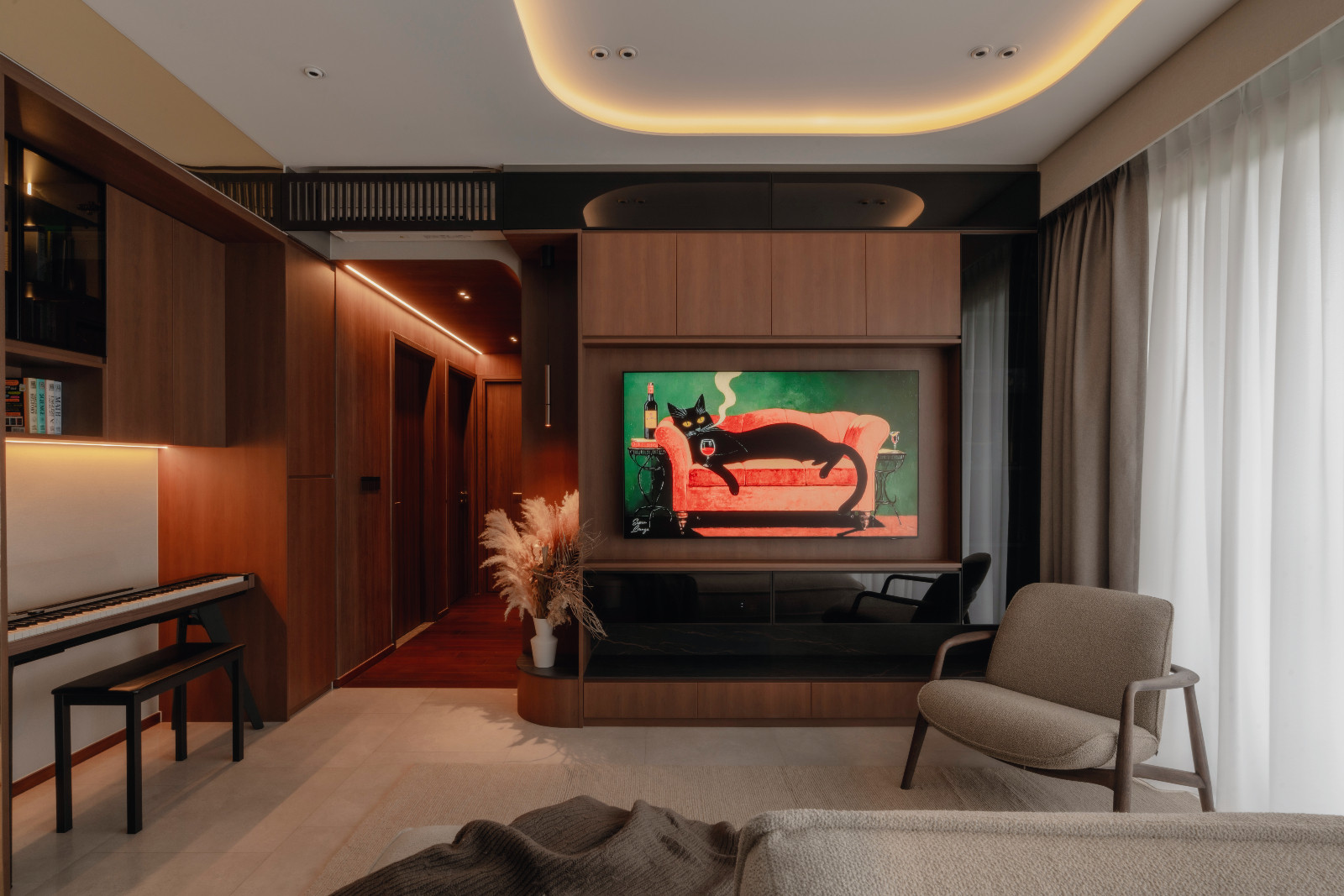 This cosy, wood-toned living room is furnished with a sofa, armchair and rug from Bolia