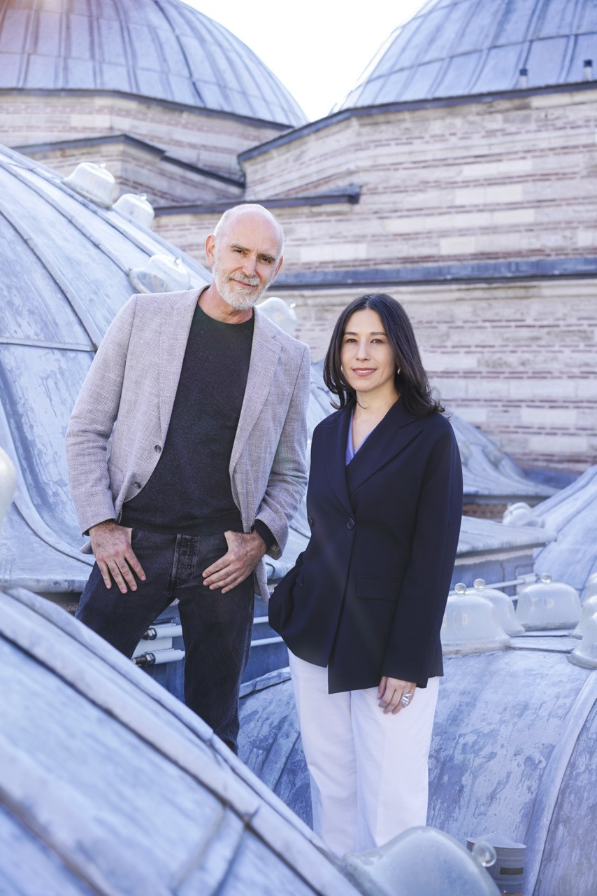 Alex Červený and Anlam de Coster on the roof of Zeyrek Çinili Hamam, among the domes above the bathhouse