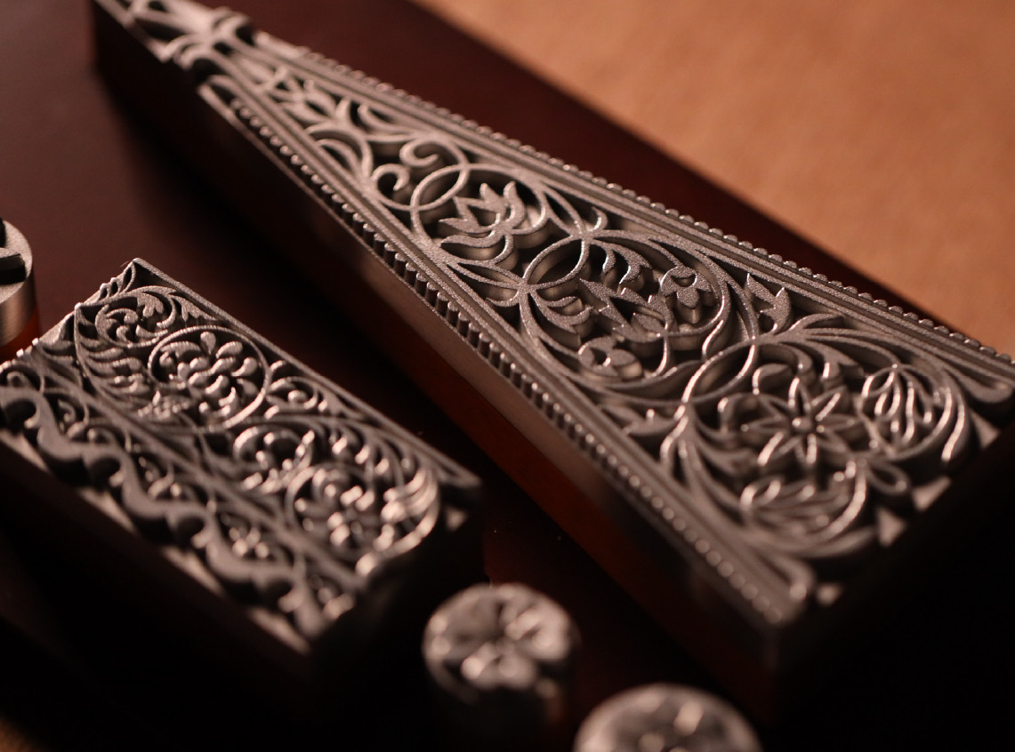 The six pewter plaques preserve the relief and intricate details of the original carvings