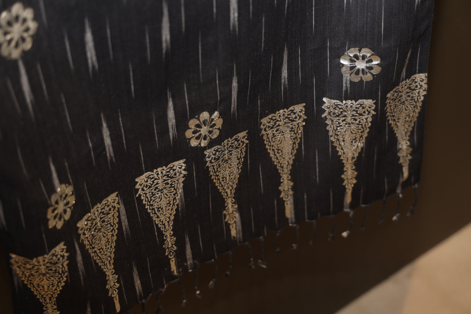 The pewter plaques adapt the traditional method of textile printing upon fabric