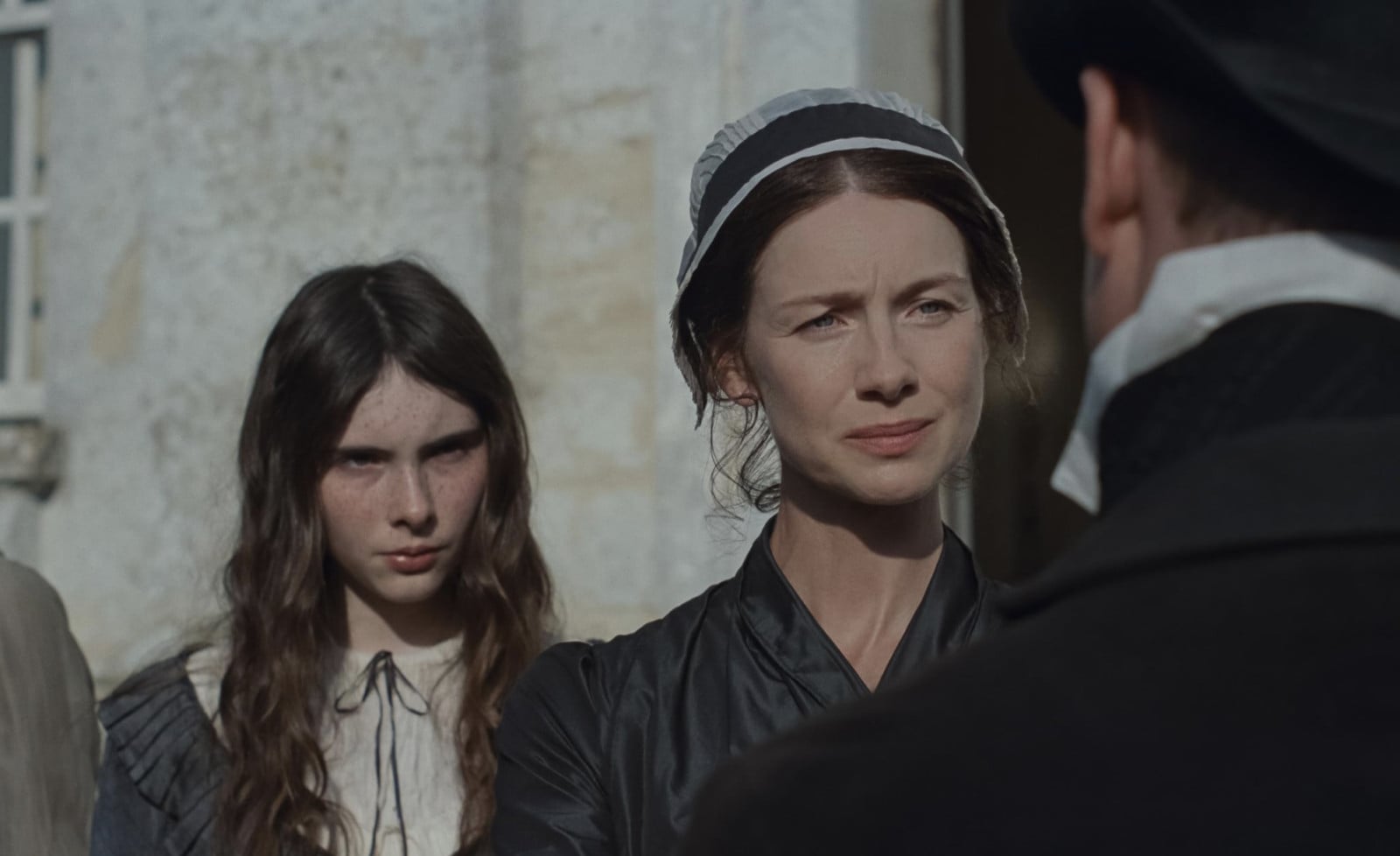 Caitríona Balfe as Mrs. Dashwood alongside a younger Dashwood sister in a scene from the upcoming Sense and Sensibility adaptation.
