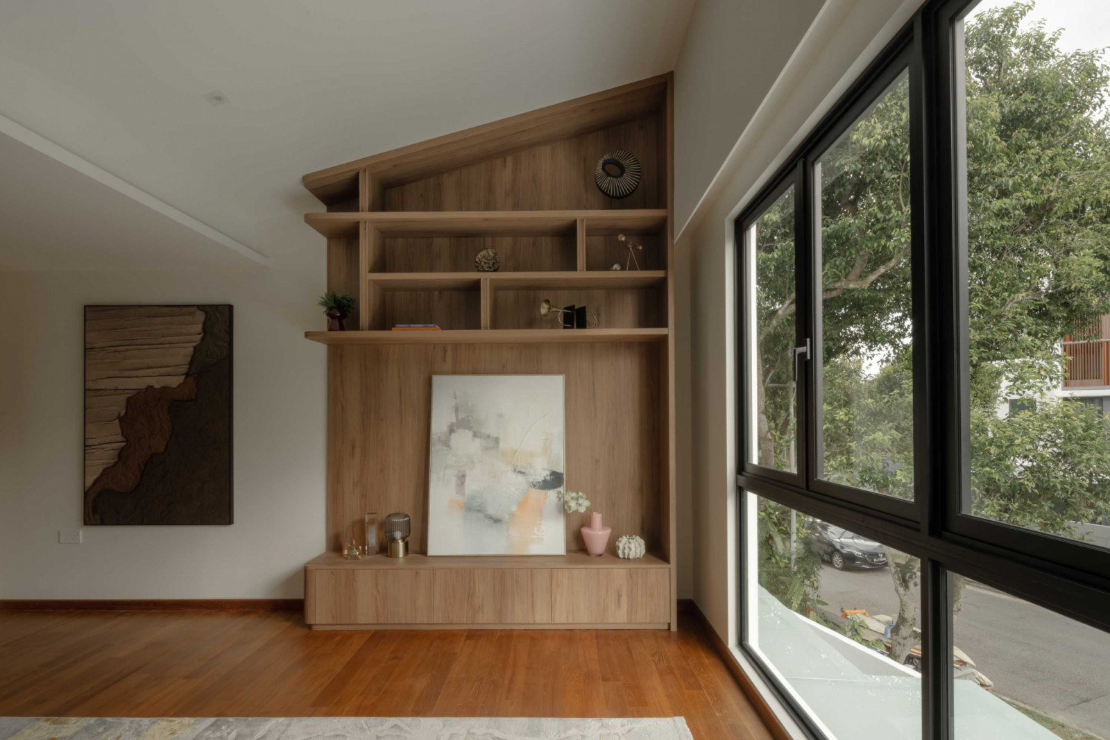 Custom carpentry nicely fills out the master bedroom’s slanted ceiling