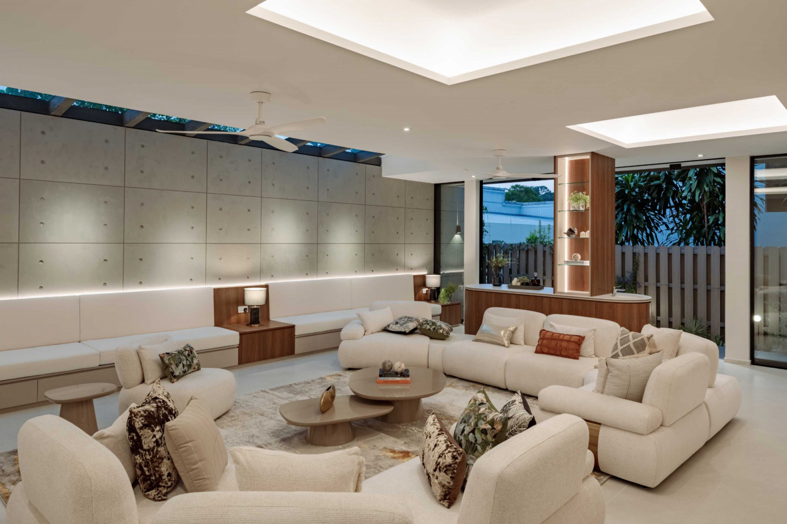 The basement lounge is grounded by an off-form concrete feature wall