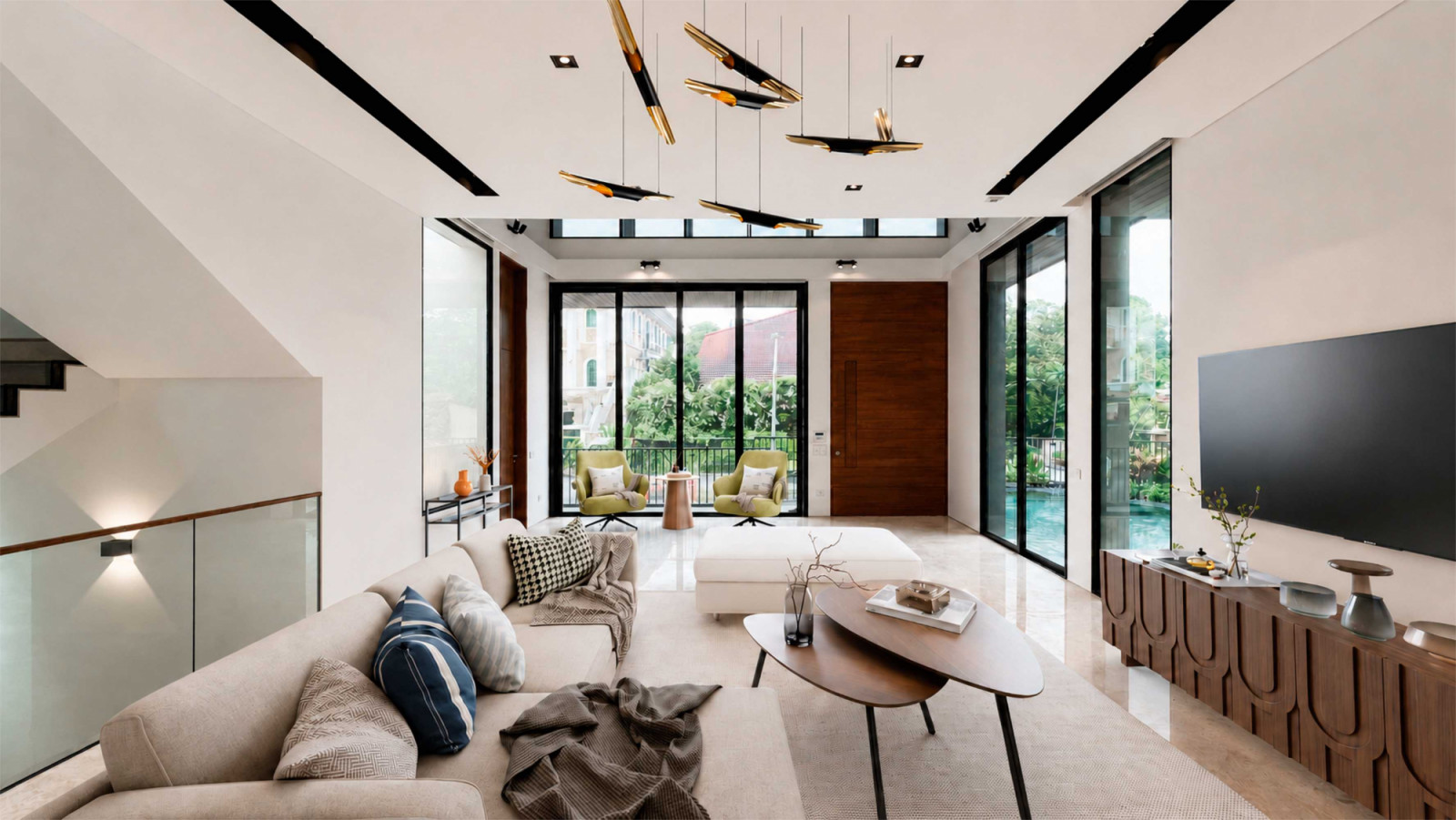 Its light-filled living room features full-height glazed windows overlooking the pool