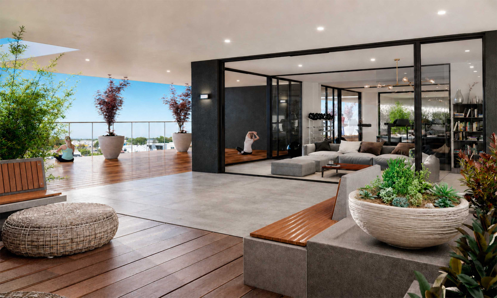 The stylish gym at Elements at Carousel features a spacious deck that overlooks the cityscape