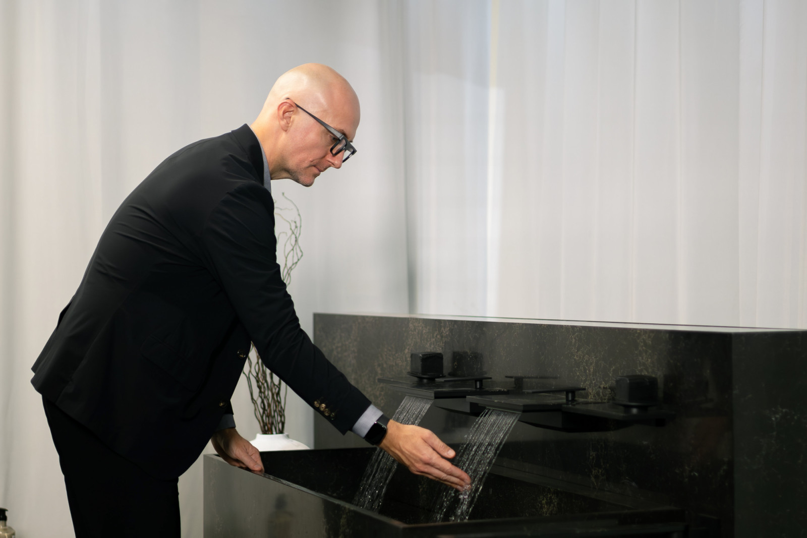 Besseyre des Horts tests the Grohe Spa Allure Gravity spouts in the ritual sanctum
