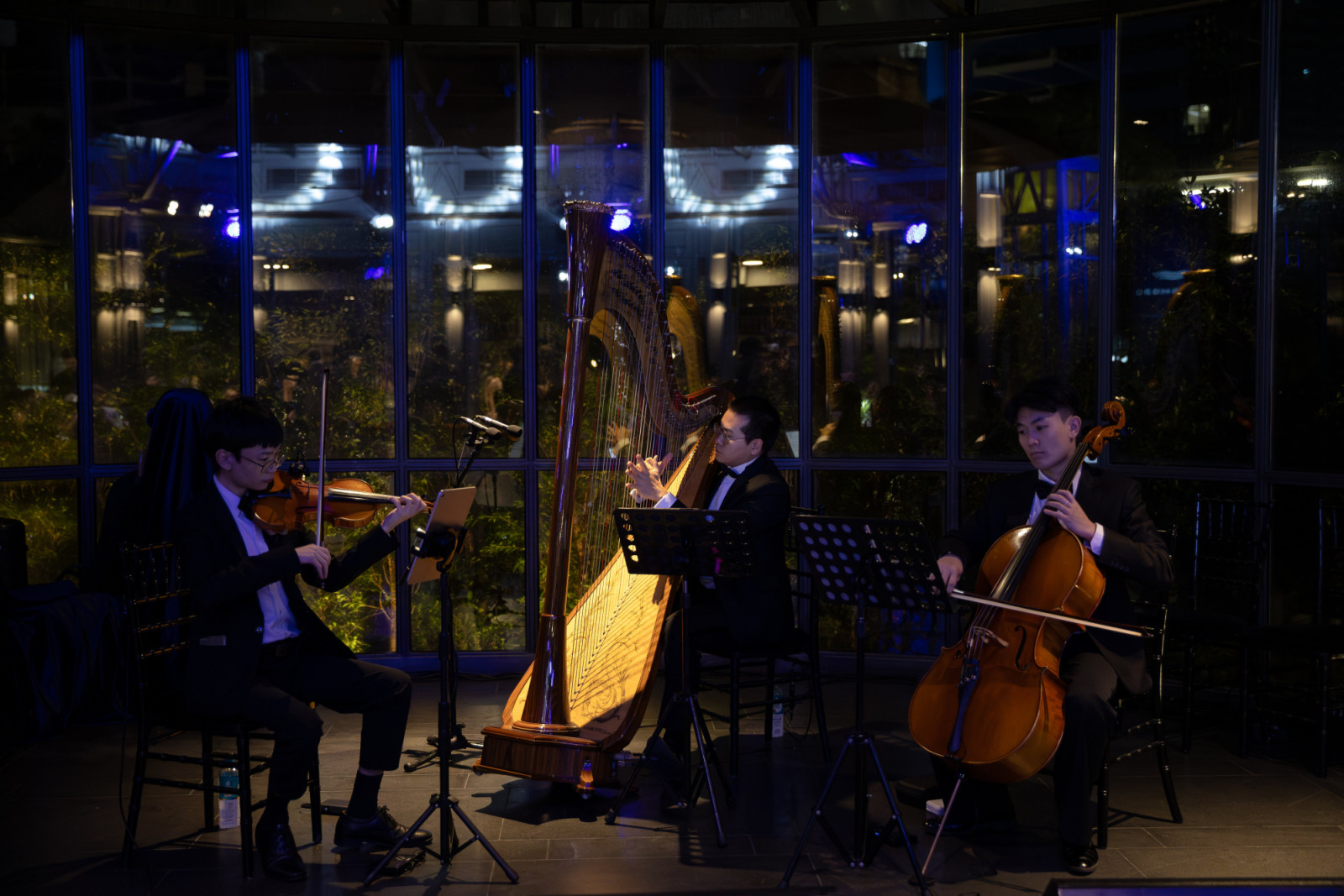 A string trio, harp included, played during gala dinner at Nai Lert Park