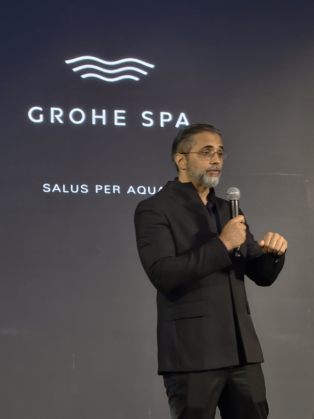 Bijoy Mohan, executive vice president of Lixil International, welcomes guests to Grohe Spa Aqua Sanctuary