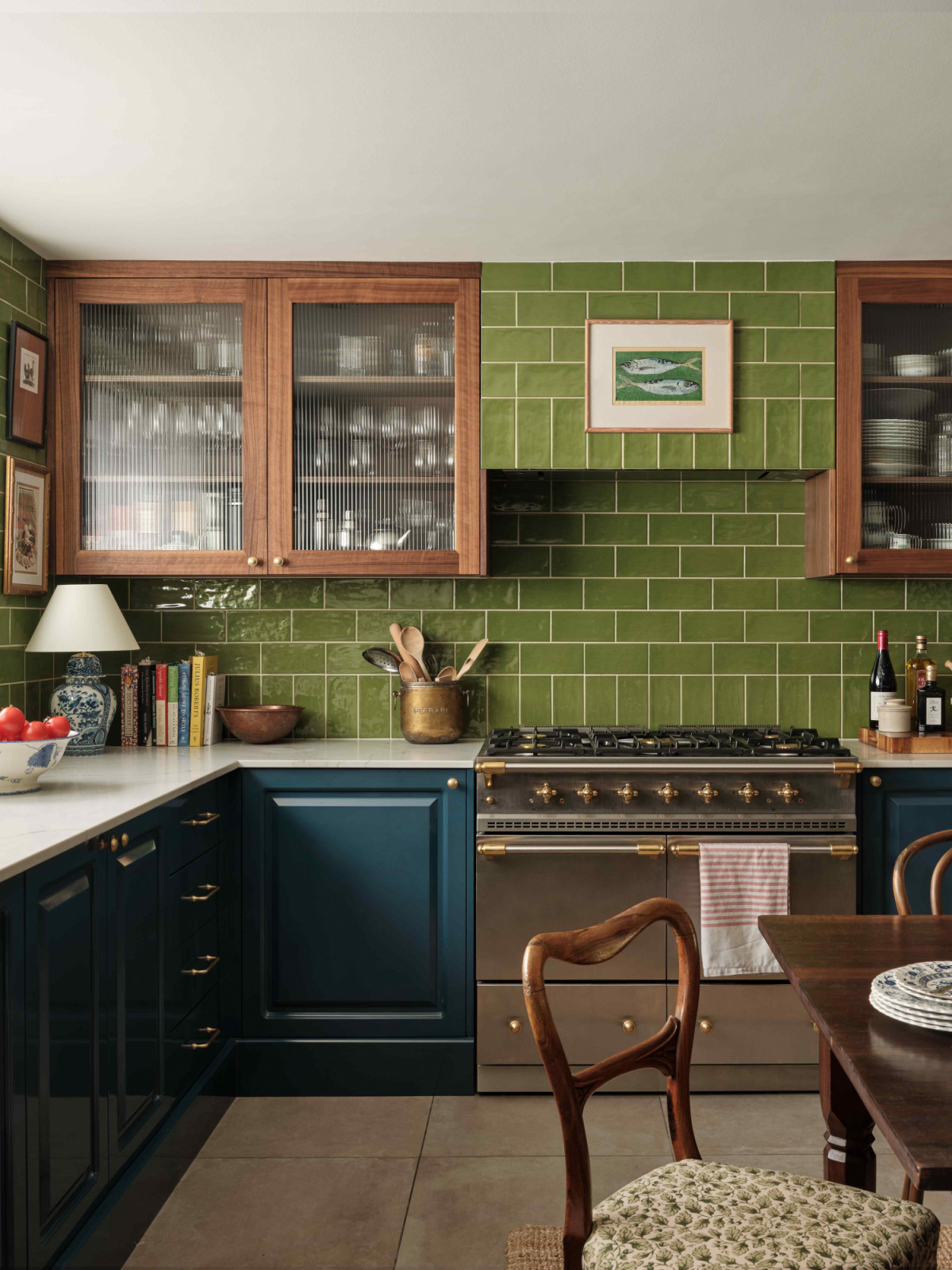 Olive green metro tiles and bespoke cabinetry in deep blue