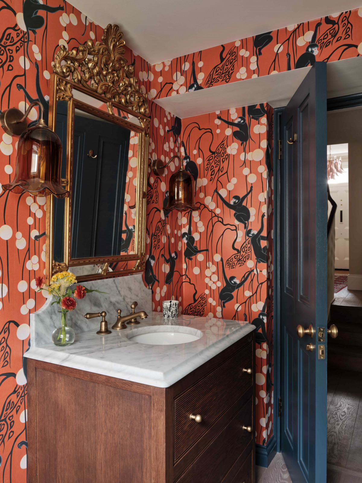 Terracotta in the guest bathroom introduces a warmer, earthier note