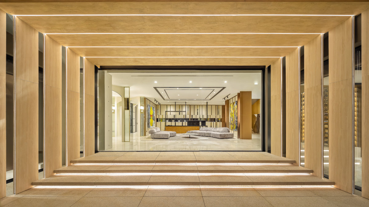 The architectural framing of this seating area, furnished with Edra sofas, mimics that of the larger wing