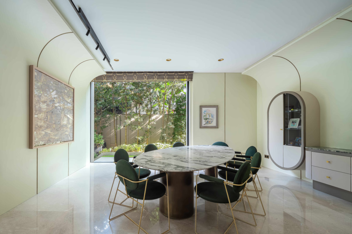 Frameless sliding doors by Panoramah! frame uninterrupted garden views in the breakfast room, alongside Dawn Ng’s “Evelyn’s Breath was Oxygen I Leaned to Take in”, and a sketch acquired in Montmartre