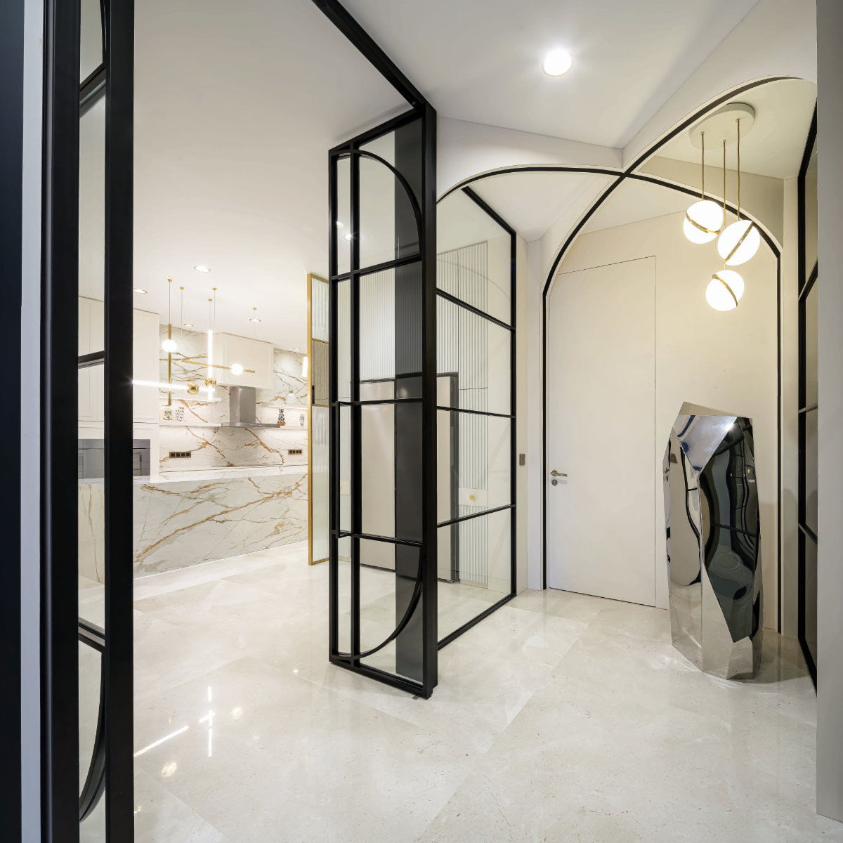 The area leading to the kitchen features arches inspired by Versailles’ Hall of Mirrors