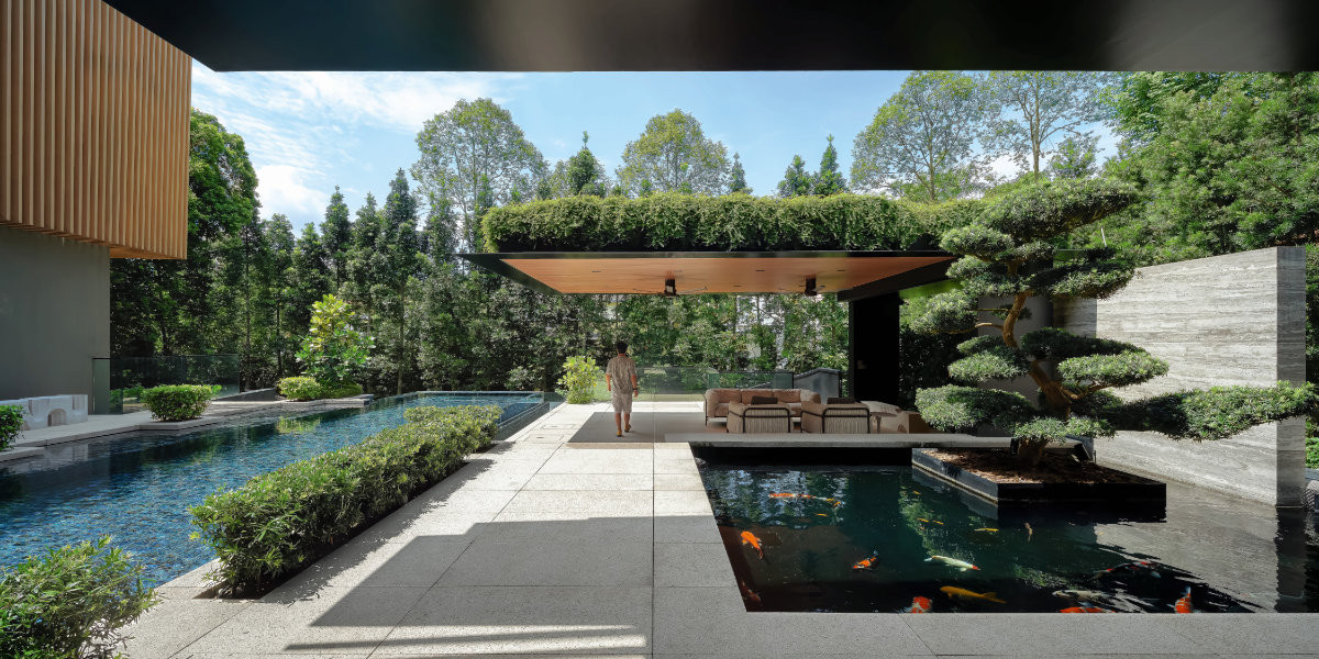 The razor-thin canopy of the poolside gazebo, its roof crowned with greenery, makes for a striking architectural vignette