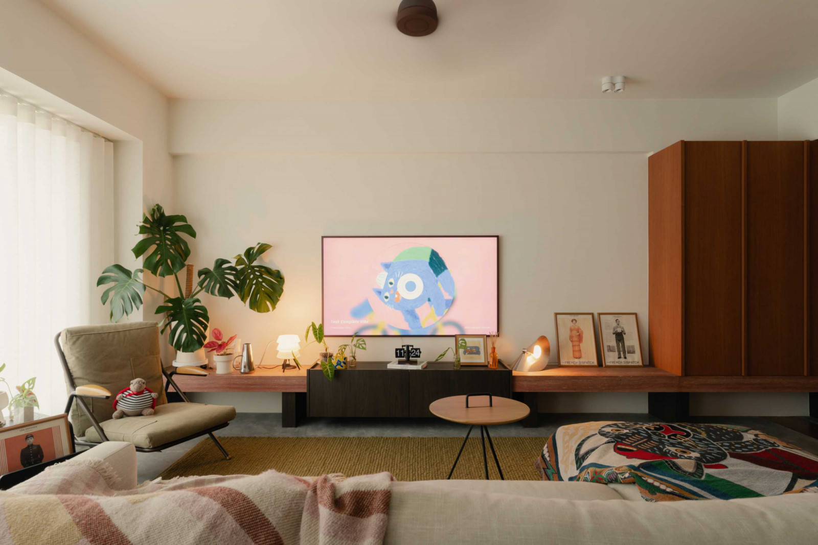 A low-slung media console and lived-in furnishings bring warmth to the living space