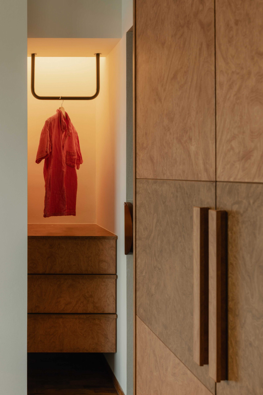 This well-lit niche serves as a visual canvas for hanging garments