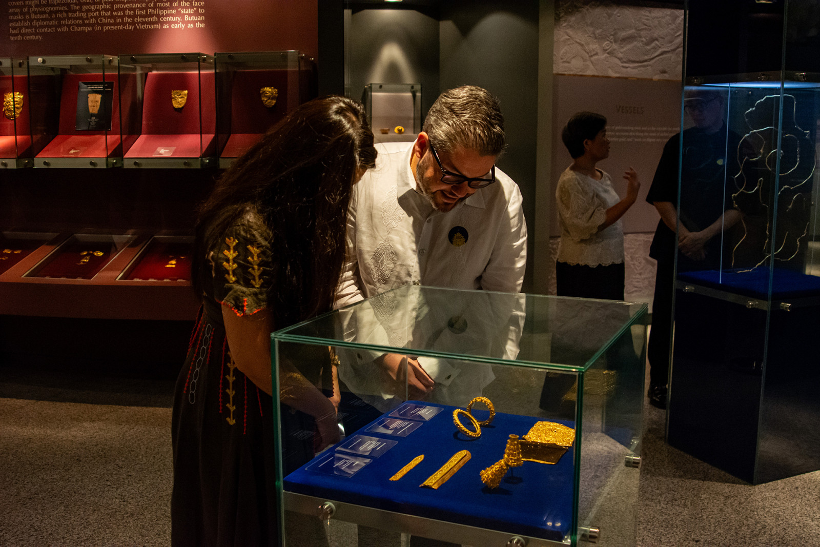 Guests observe ancient gold artefacts and jewellery at Ayala Museum