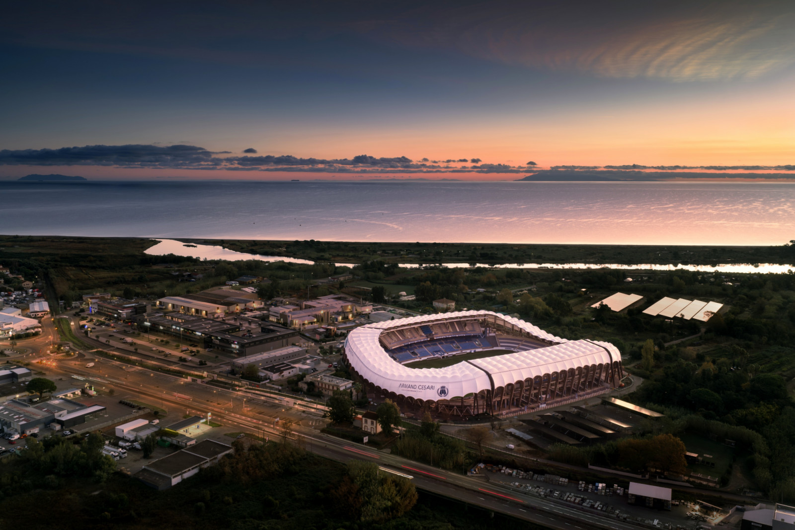 The stadium was renovated by Ateliers A+ in 2025 to open up to its setting of mountains and sea (Photo: Banzaiprod)