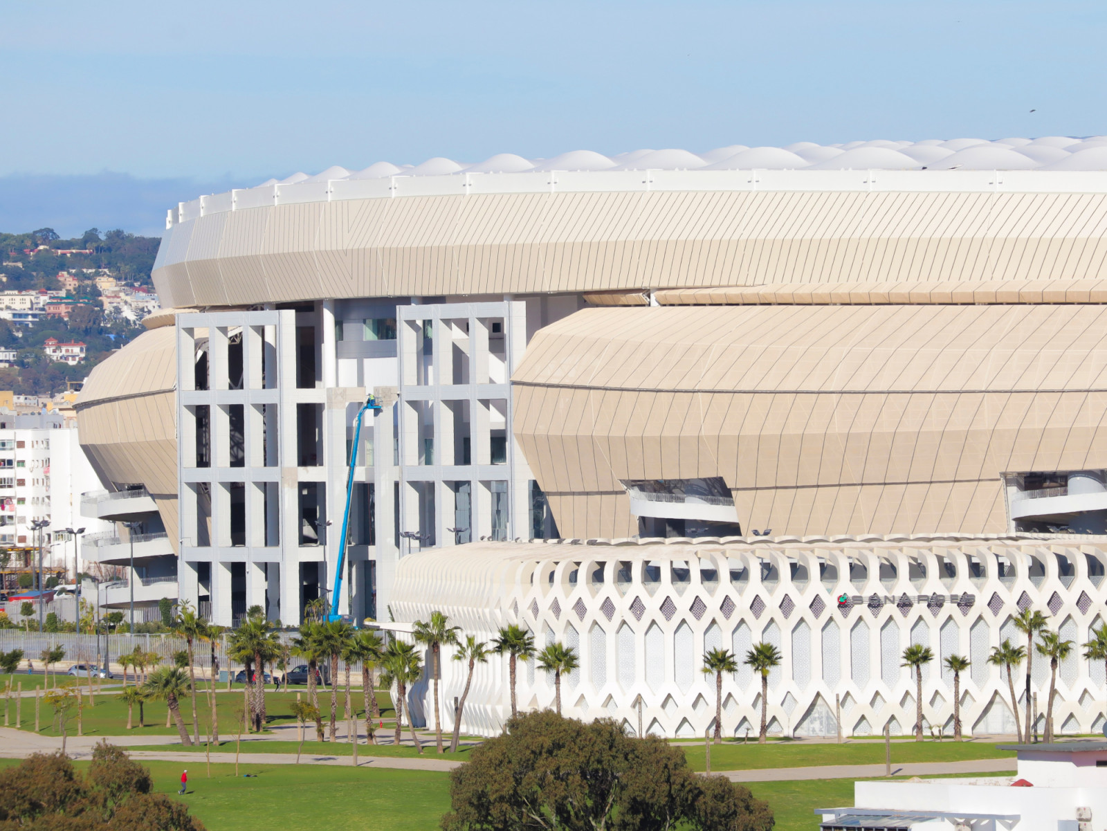 Layered bands of faceted cladding wrap the stadium, which was transformed under architect Anouar Amaoui ahead of the 2025 Africa Cup of Nations and the 2030 FIFA World Cup. (Photo: Morocco lens)