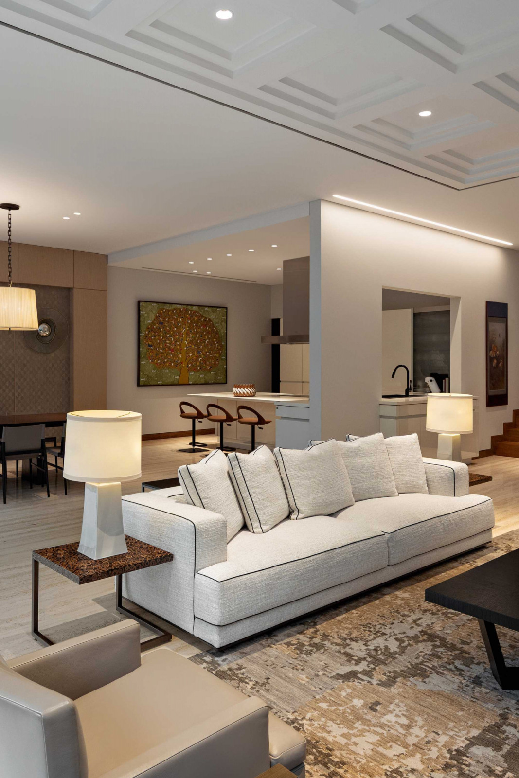 Light-coloured materials and a white sofa were selected because the homeowner is meticulous about keeping her house in tip-top condition