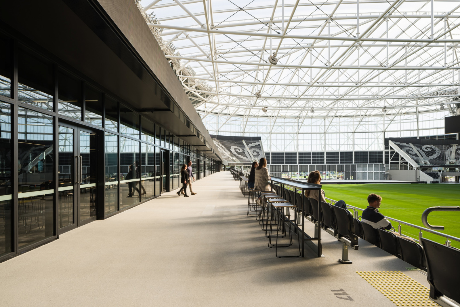One New Zealand Stadium, Te Kaha, sits in central Christchurch with the hills of Canterbury behind it. Designed by Populous and Warren & Mahoney, its facade references mountains, waterways and the colours of the changing seasons (Photo: Dennis Radermacher)