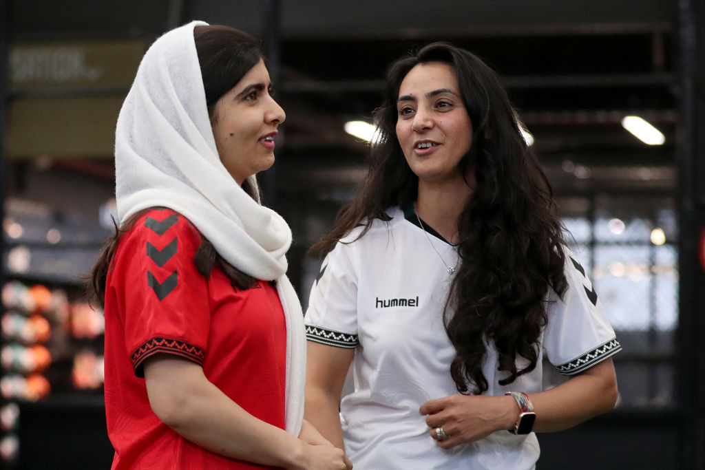MELBOURNE, AUSTRALIA - AUGUST 19: Khalida Popal, Director of the Afghan Women's Team speaks with Nobel Peace Prize winner Malala Yousafzai meets with members of the Afghan Women's Team at Ultra Football on August 19, 2023 in Melbourne, Australia. (Photo by Kelly Defina/Getty Images)