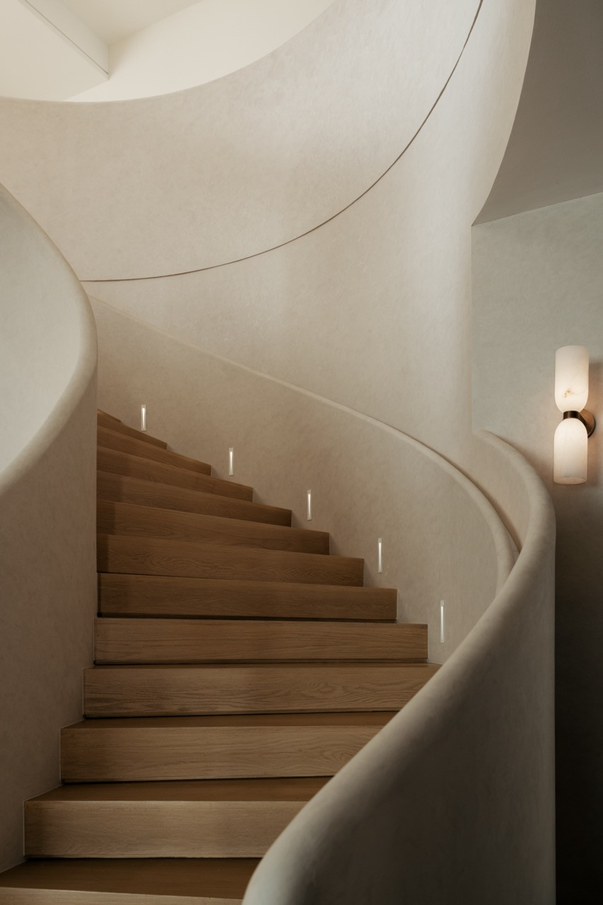 The elegantly curved staircase
