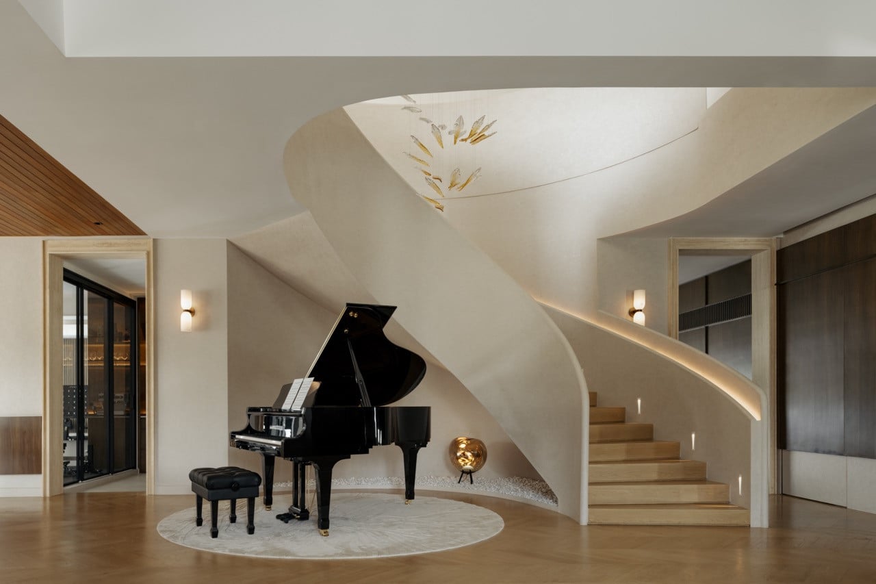 The spiral staircase, which the clients fell for on their first visit, was retained and made the centrepiece of the home, with a grand piano tucked into its curve