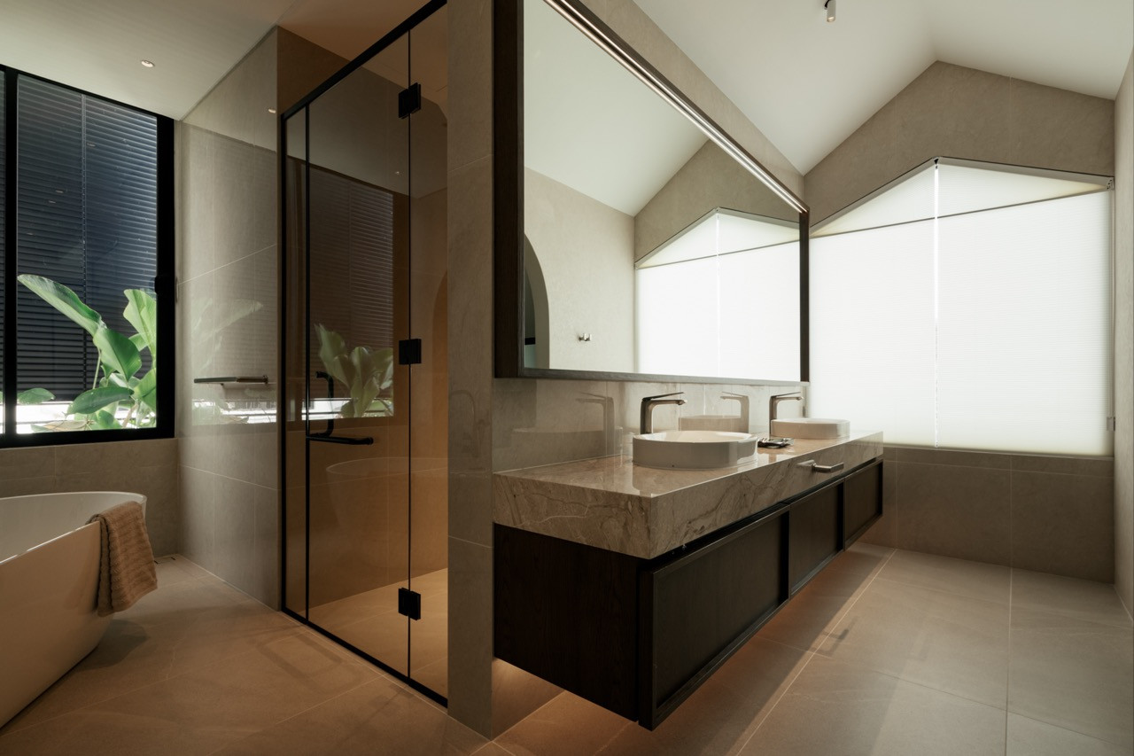 Reworking the upper floor allowed the master bathroom a freestanding bathtub and a long vanity with dual basins