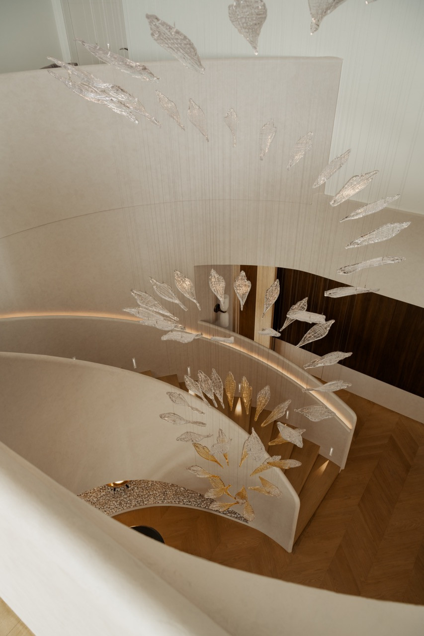 The light as air chandelier suggests flight