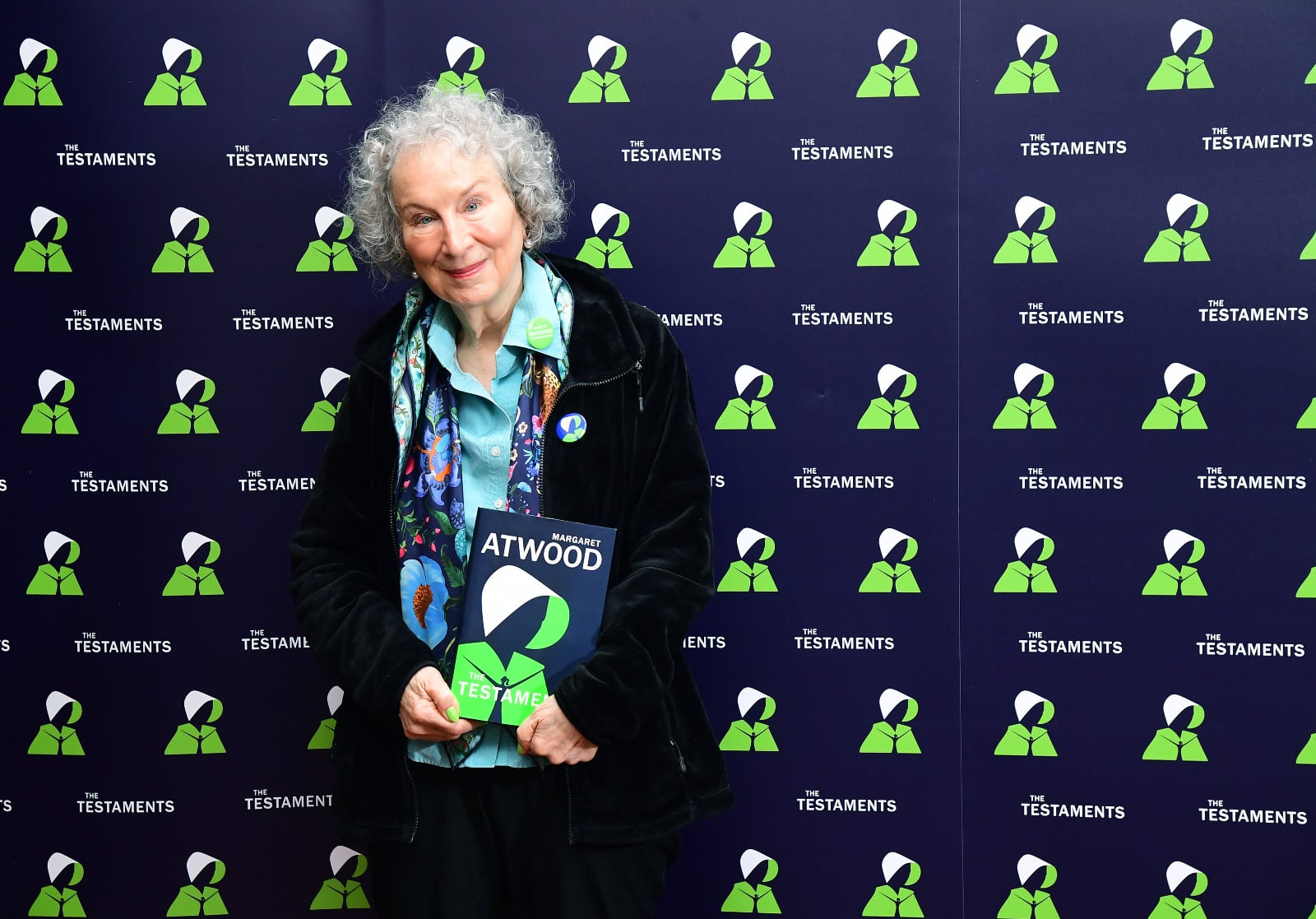 Author Margaret Atwood holds her Booker Prize-winning novel, "The Testaments".