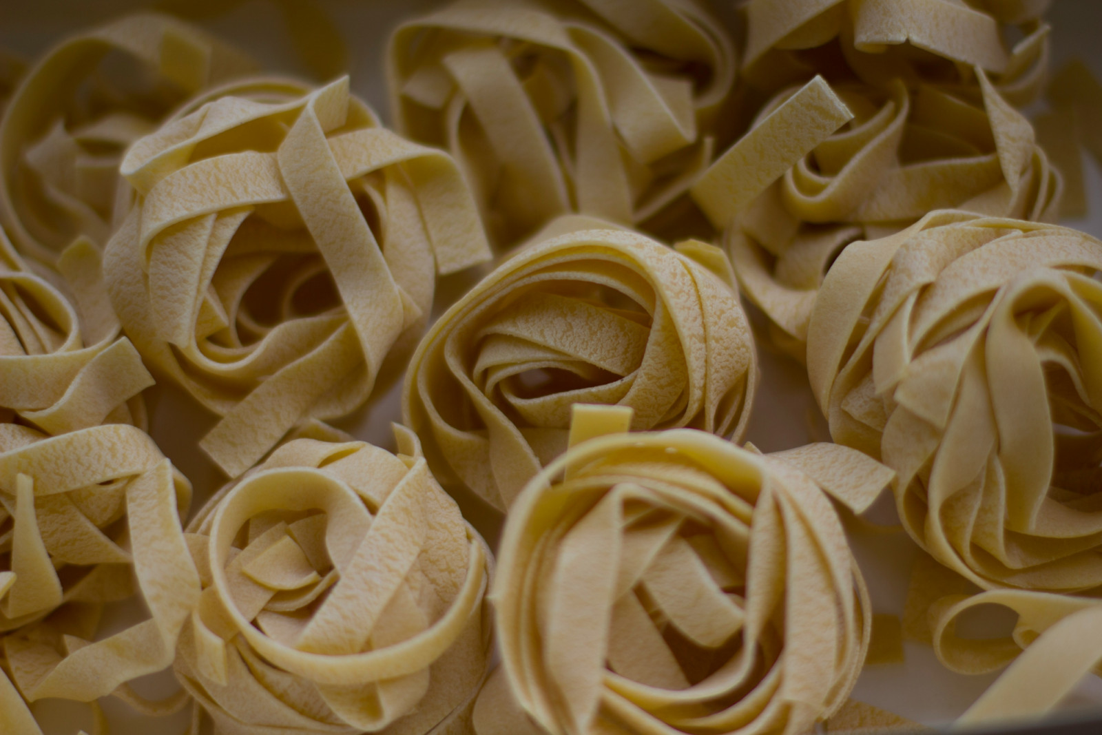 Tagliatelle nests exemplify a classic pasta shape.