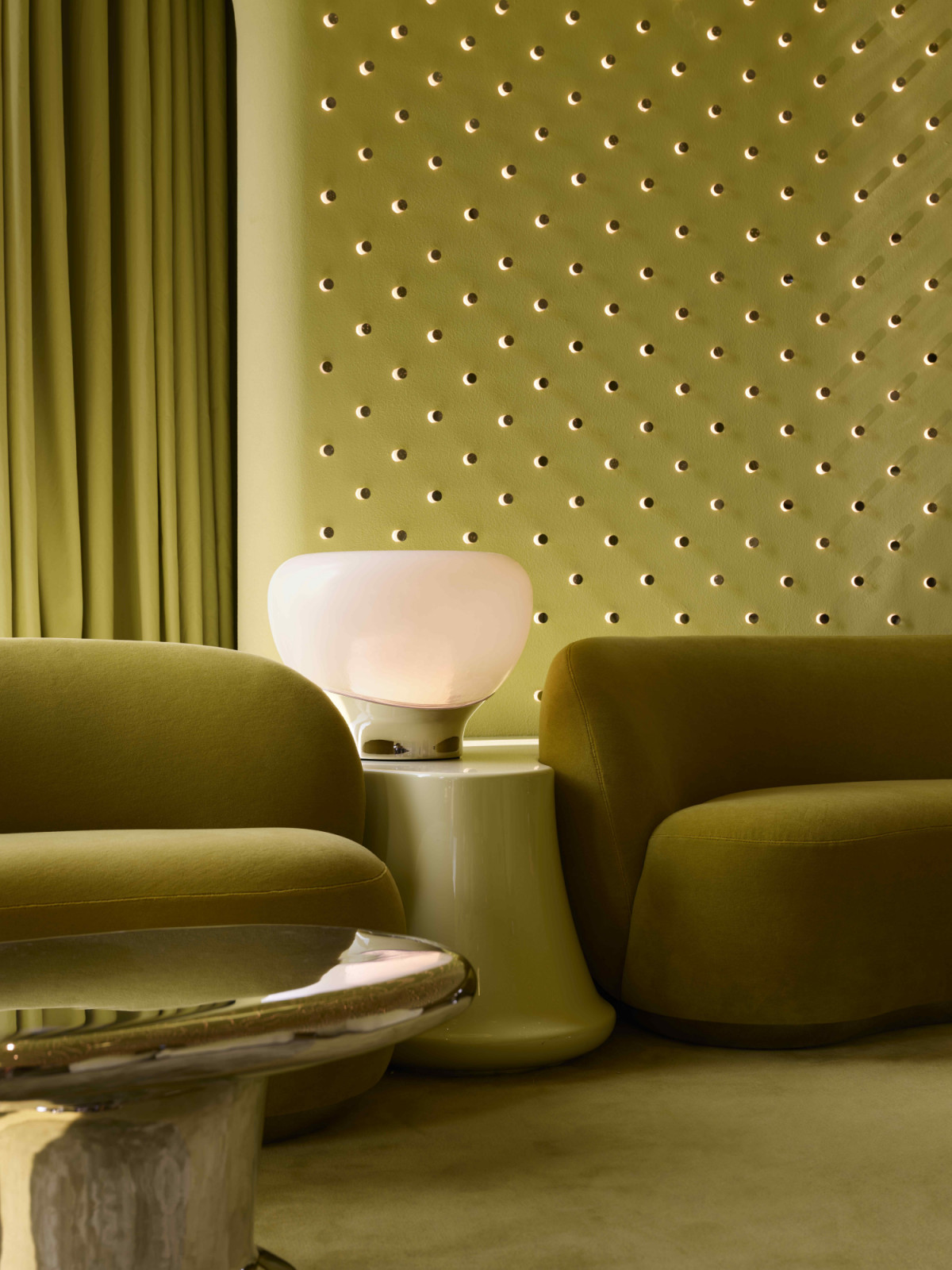 Plush mohair seating and high-gloss lacquered furnishings