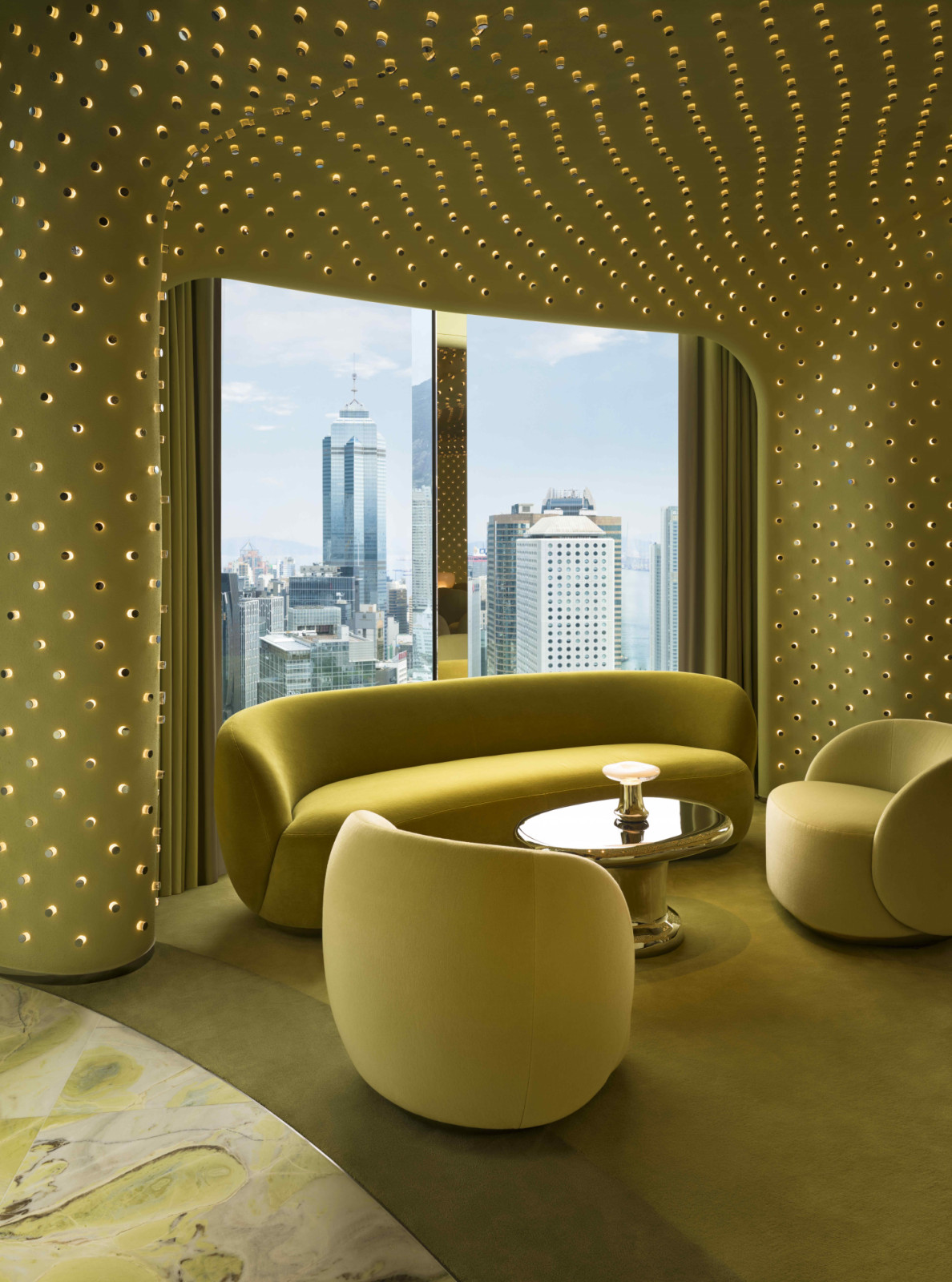 Soft green plastered volume extends across the walls and ceilings