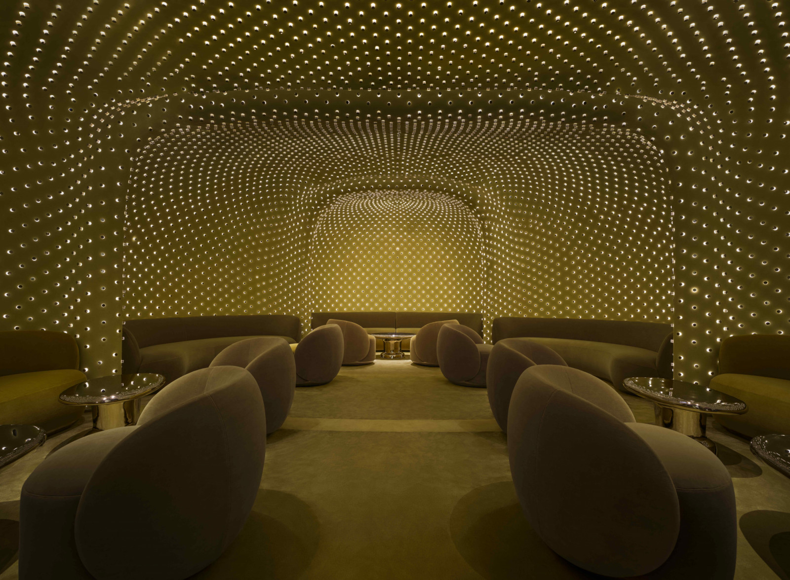 A rhythmic arrangement of frosted acrylic cylinders that cast a diffuse glow across the space