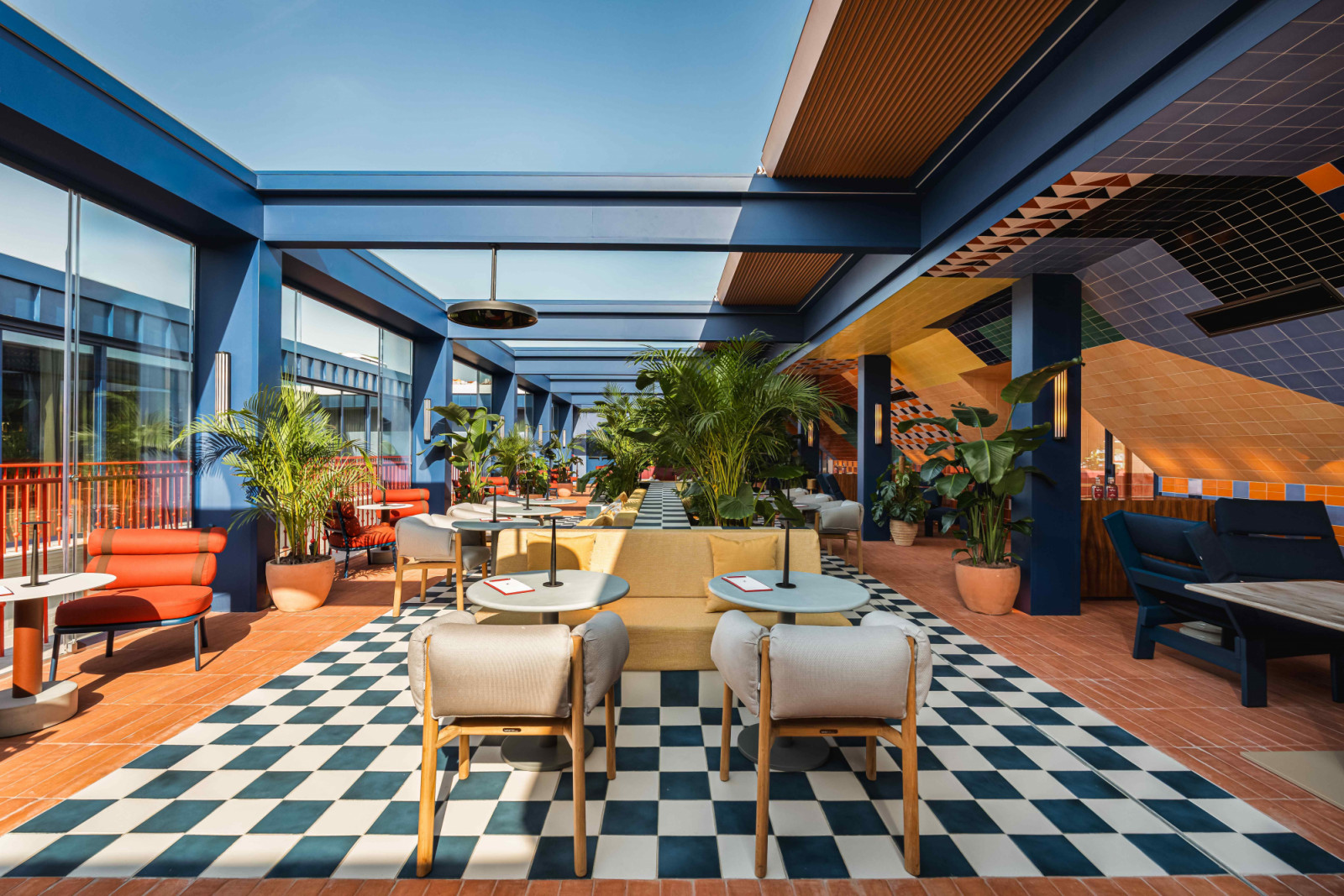 Large skylights with glass sun-shading and retractable roofs in the rooftop terrace