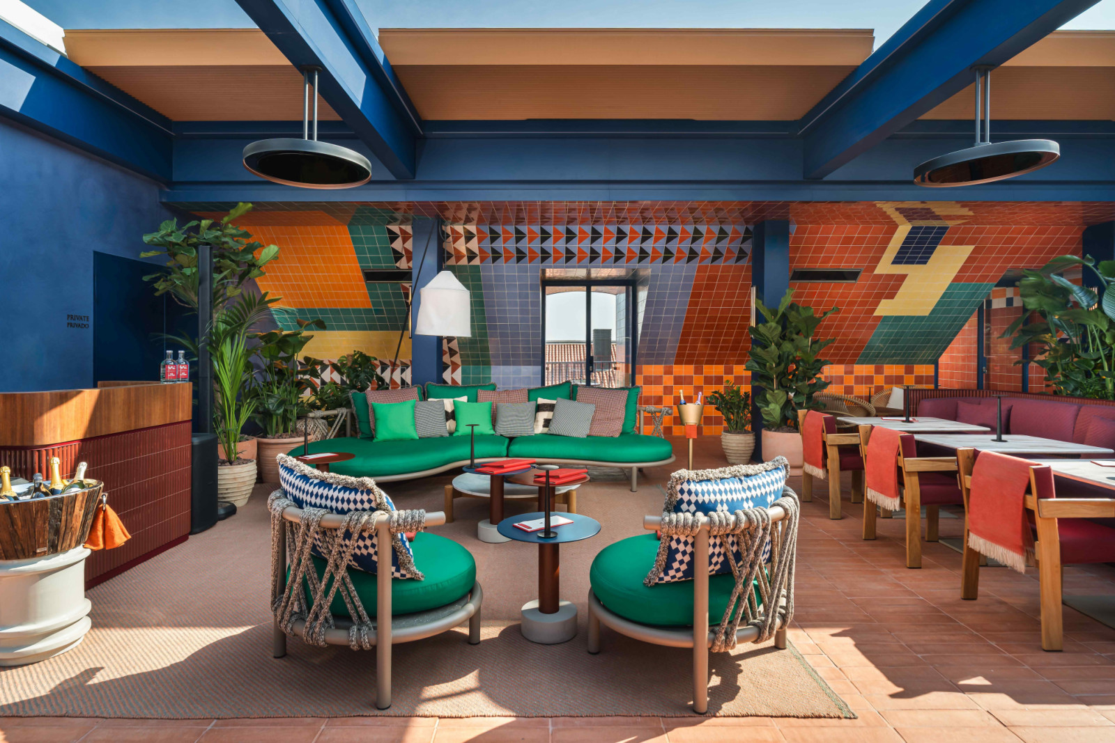 Bespoke furniture, curated artworks and expressive materials complete the setting