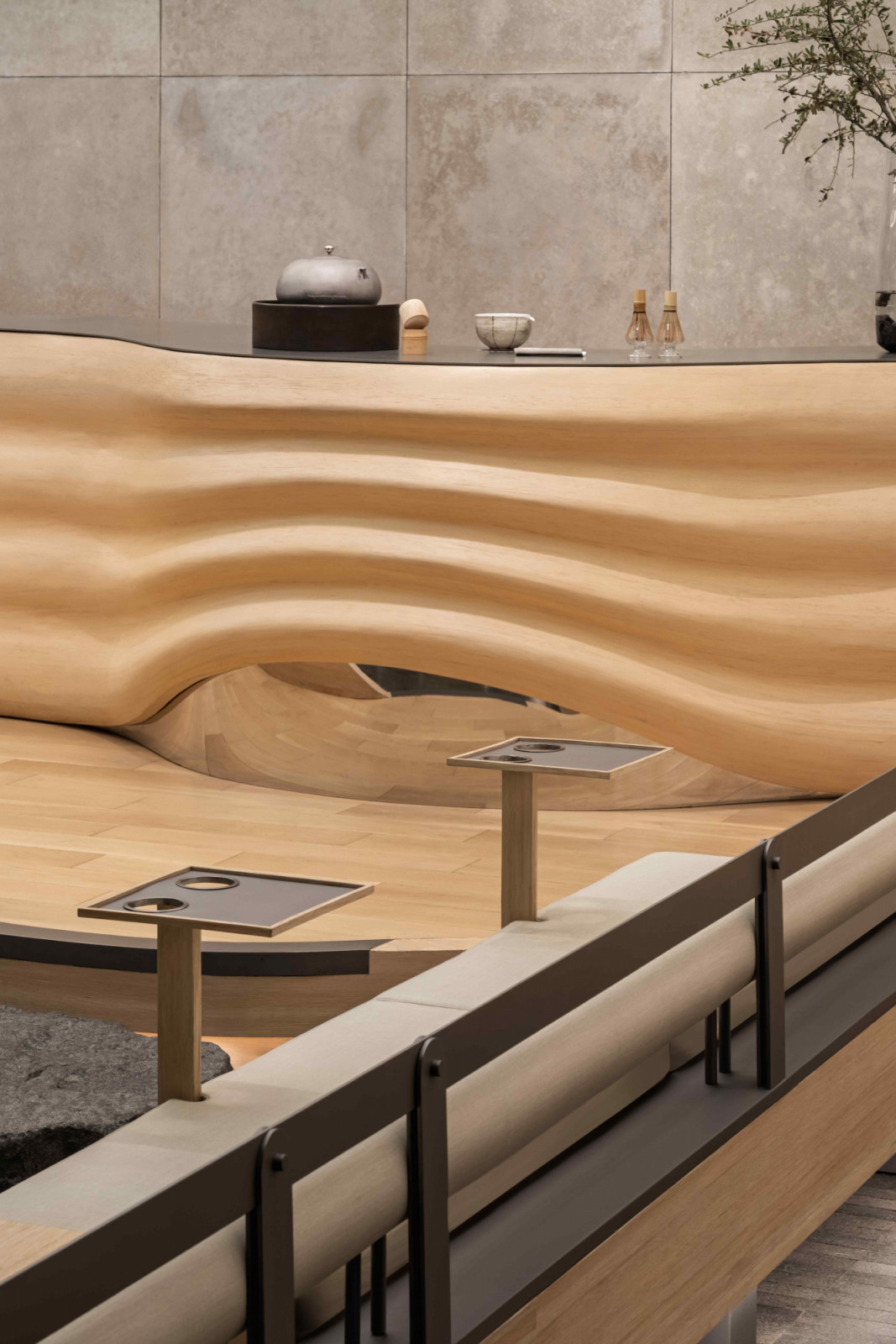 The curved, rippling counter recalls the shape of a matcha bowl