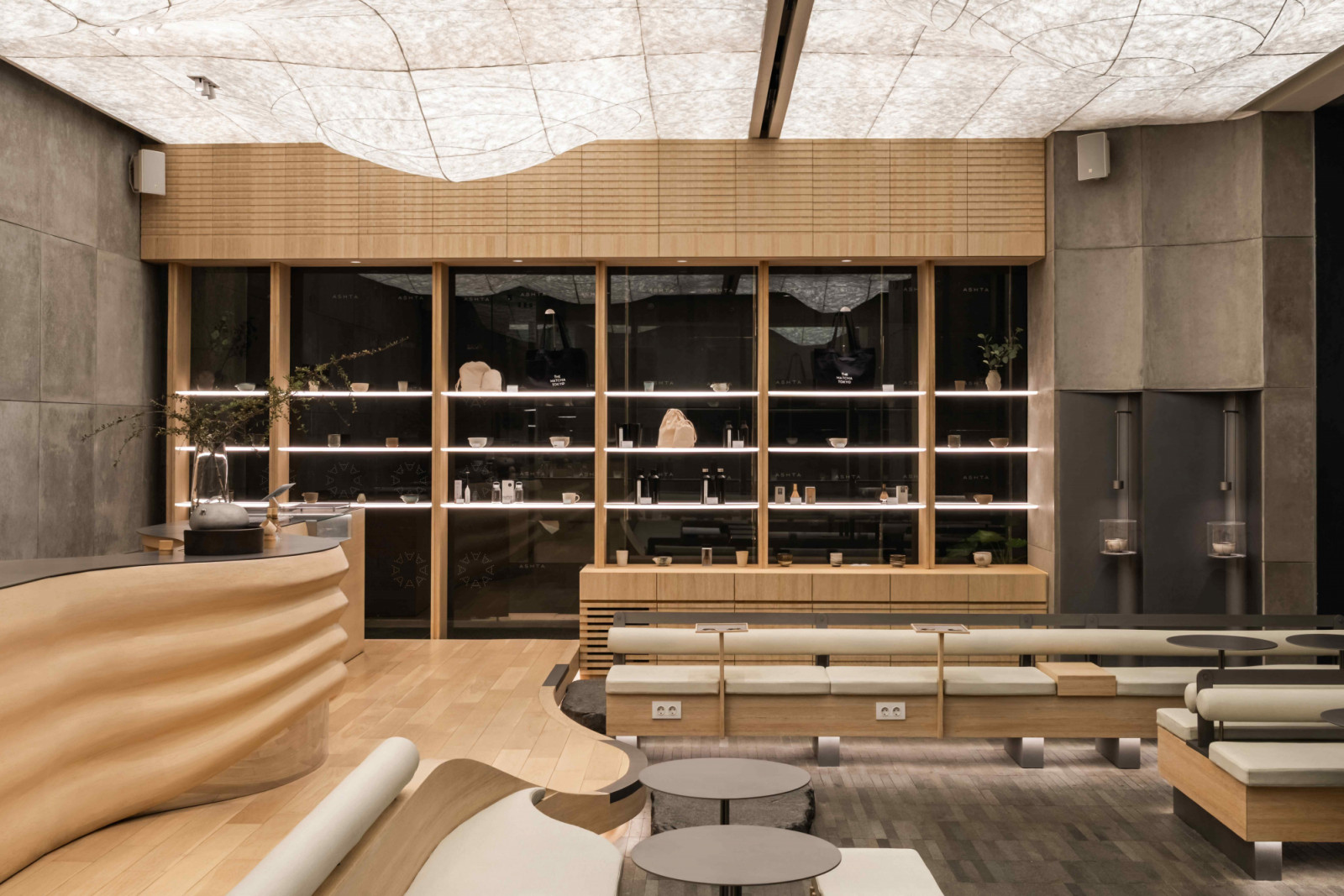 Rattan veneer infused with natural pigment wraps the cabinetry and seating