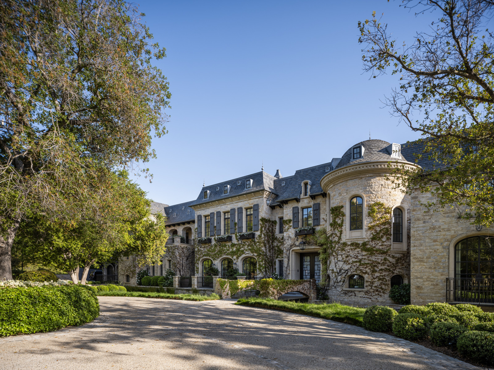 The defining exterior of the residence, with its mansard roof, copper finials and zinc cupolas