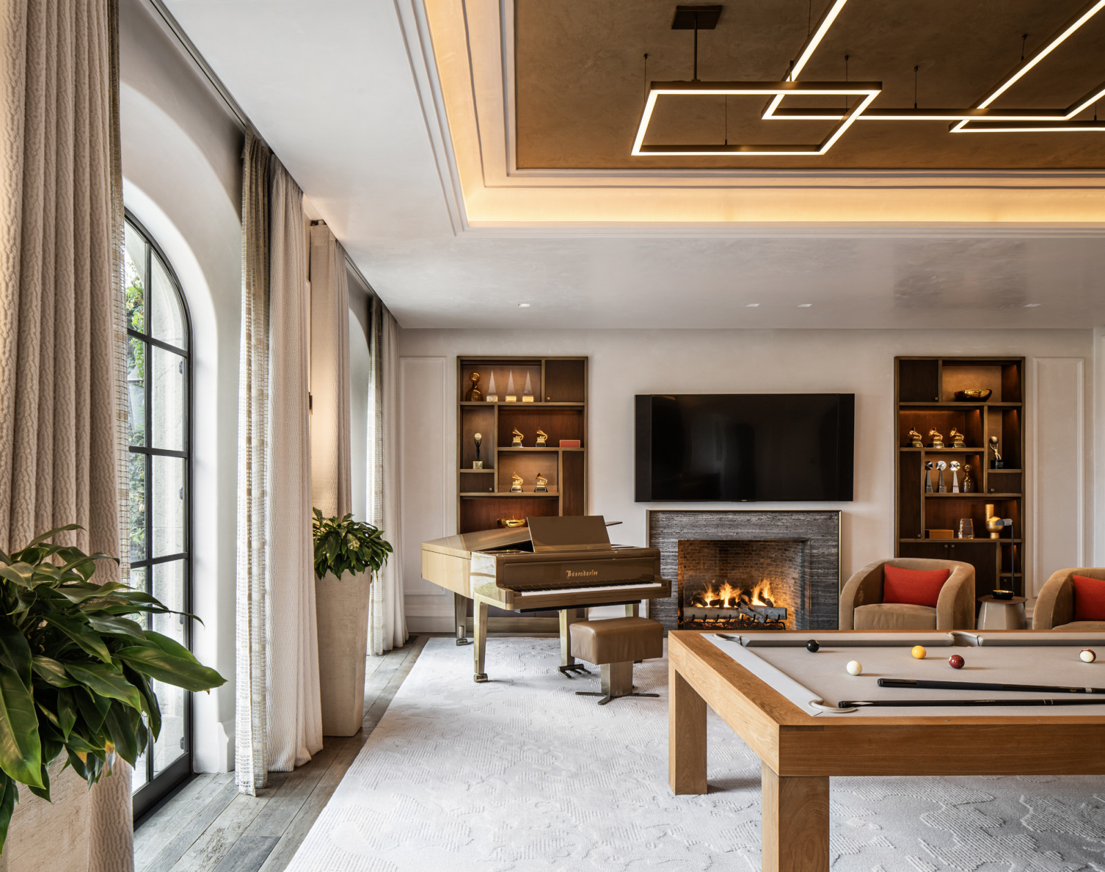 The former formal living room was reconfigured to incorporate a parlour with a built-in bar and a games room