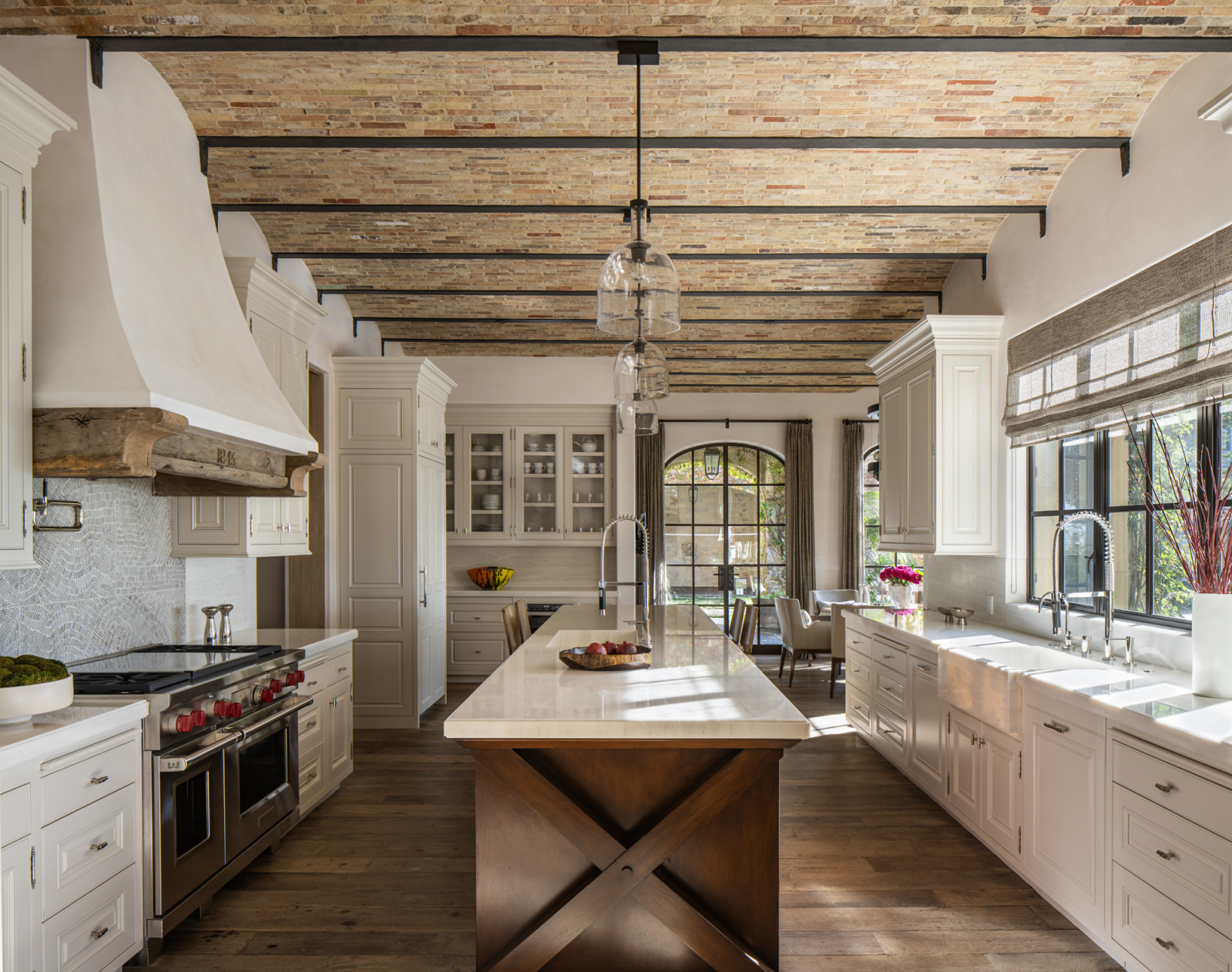 The spacious kitchen balances glamour with a sense of permanence