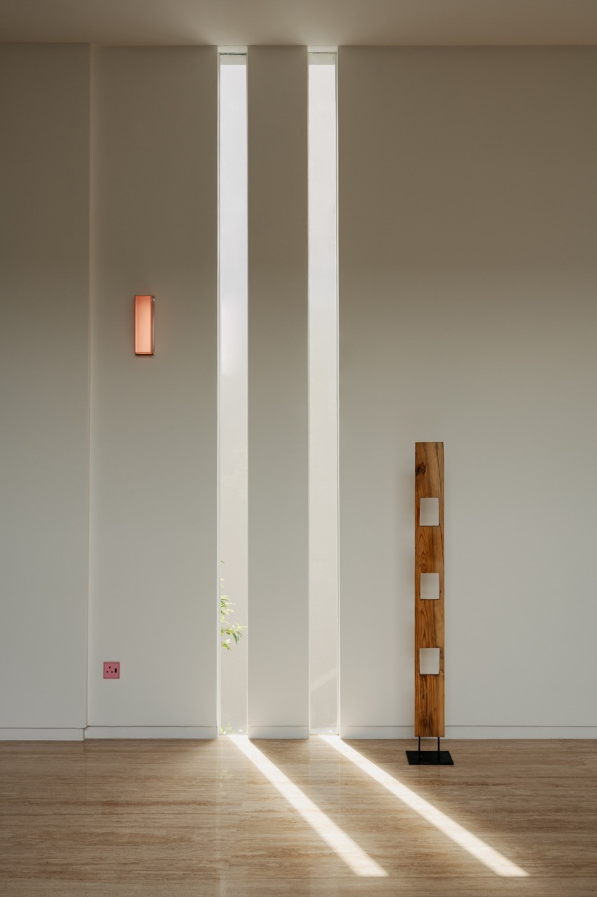 Slivers of daylight cut across the dark stairwell, one of the small architectural details Wong pointed to as her favourite