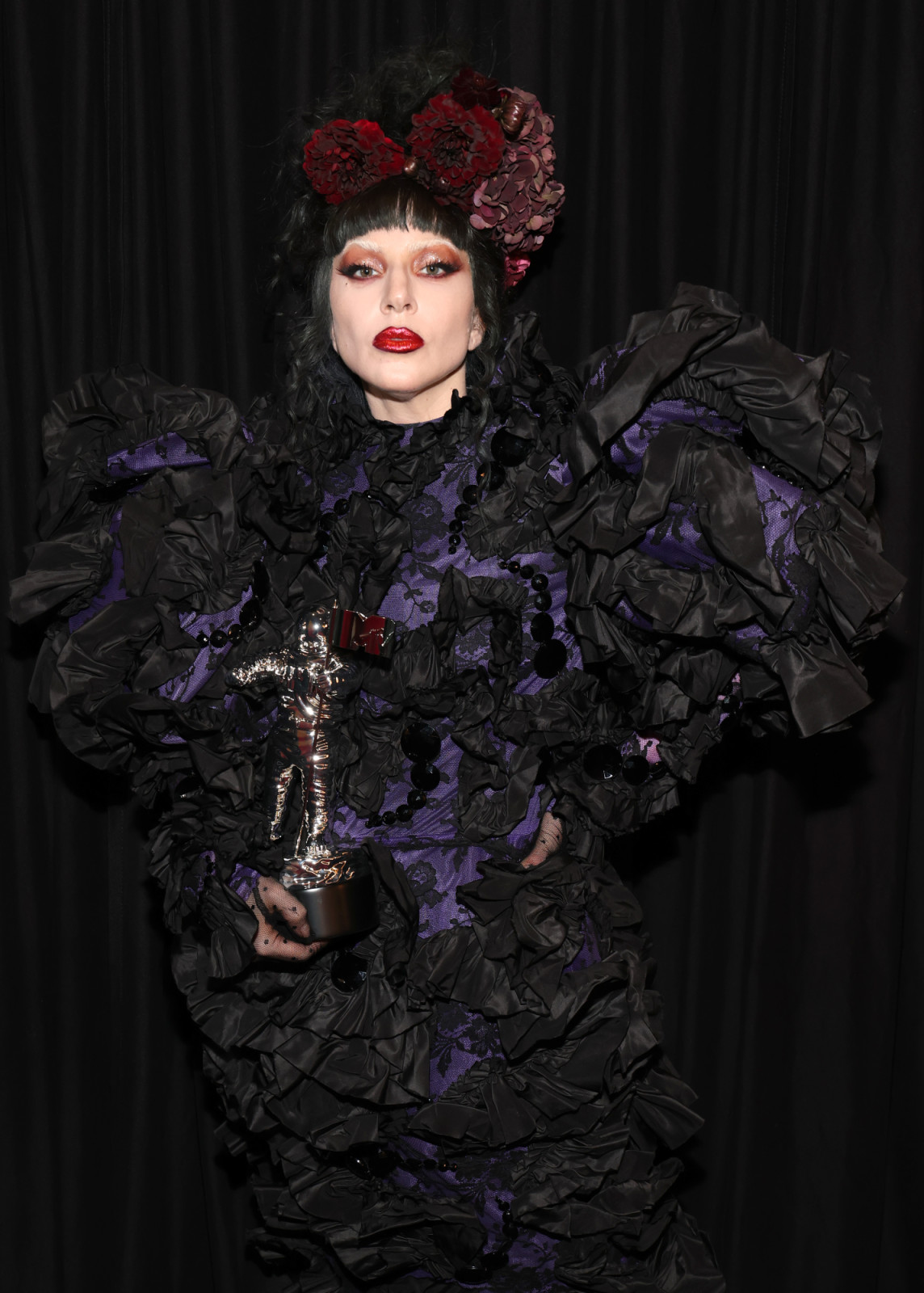 ELMONT, NEW YORK - SEPTEMBER 07: Lady Gaga poses with the “Artist of the Year” award during the 2025 MTV Video Music Awards at UBS Arena on September 07, 2025 in Elmont, New York. (Photo by Kevin Mazur/Getty Images for MTV)
